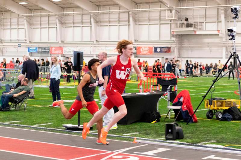 a group of people running on a track