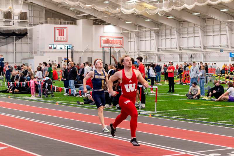 a group of people running on a track