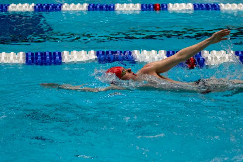 a man swimming in a pool