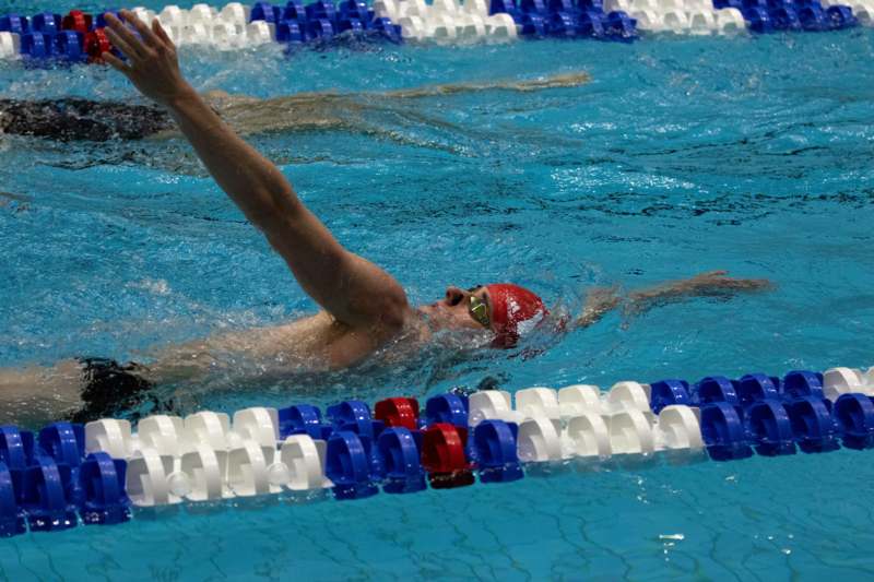 a man swimming in a pool
