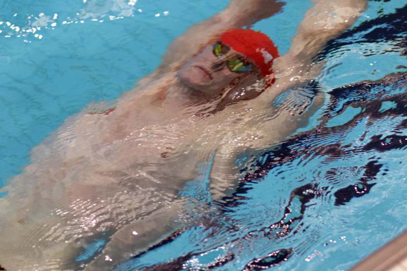 a man swimming in a pool