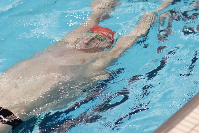 a man swimming in a pool
