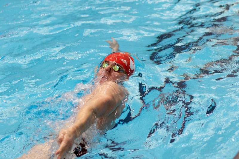 a man swimming in a pool