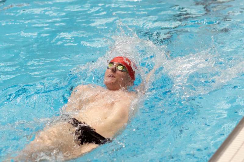 a man swimming in a pool