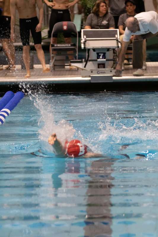 a person swimming in a pool