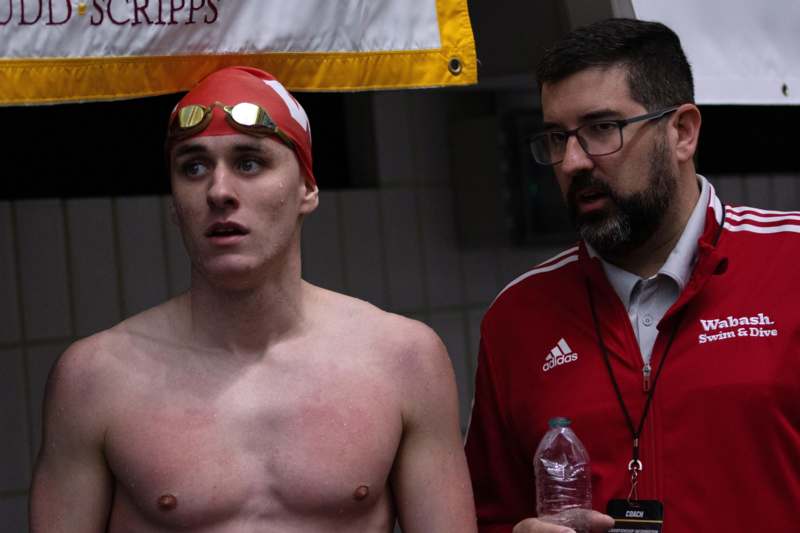 a man in a swim cap and glasses
