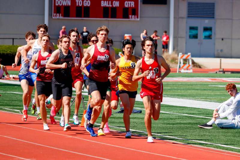 a group of people running on a track