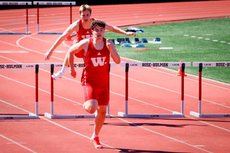 a group of people running on a track