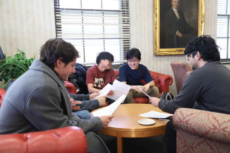a group of people sitting around a table
