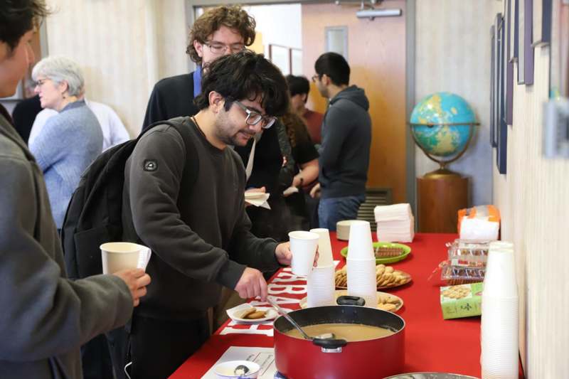 a man serving food at a table