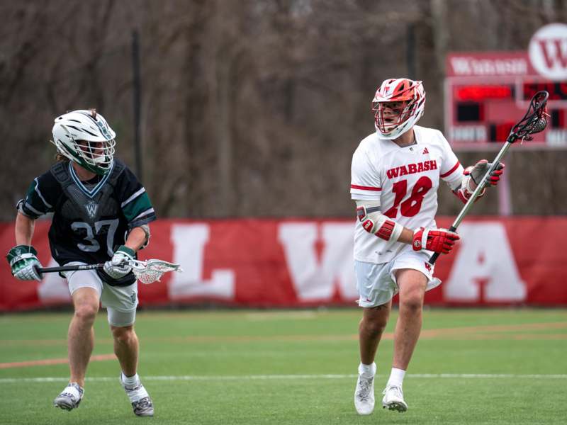 Lacrosse vs. Illinois Wesleyan University - a group of men playing lacrosse