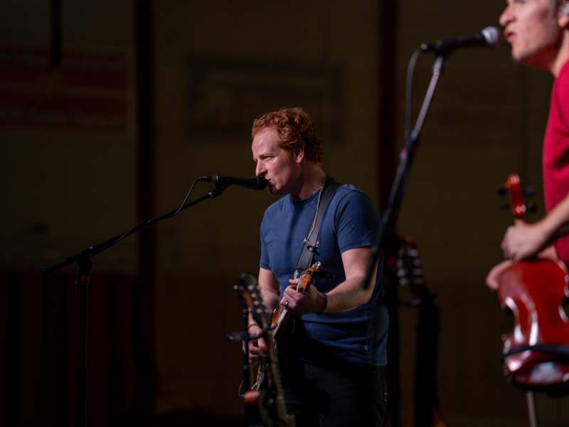 National Act 2026 - a man playing guitar and singing into a microphone