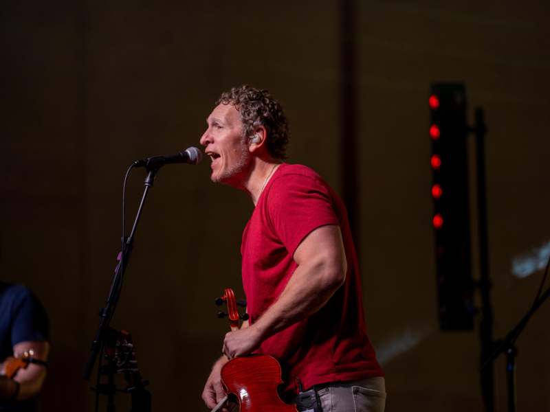 a man singing into a microphone