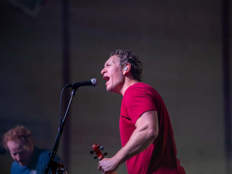 a man singing into a microphone