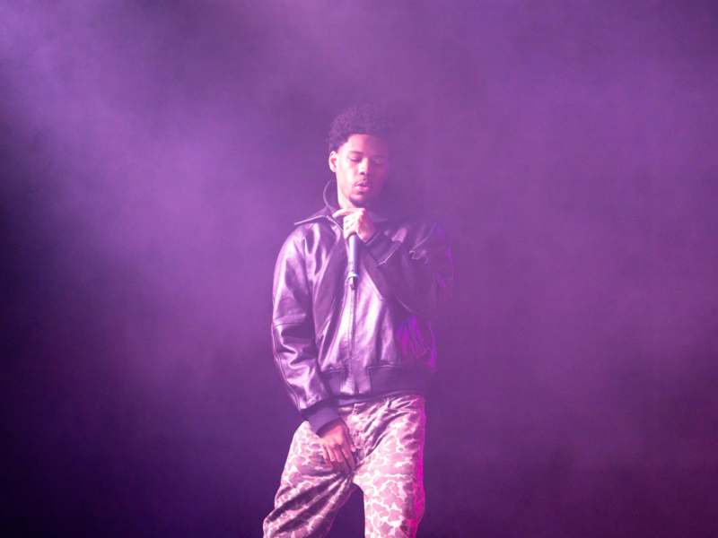 a man on stage with microphone