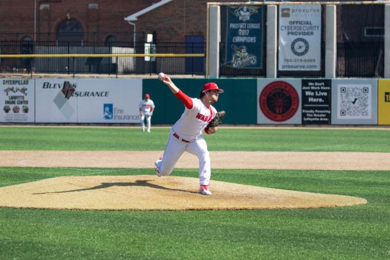 a baseball player throwing a ball