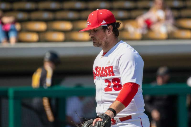 a baseball player in a red hat