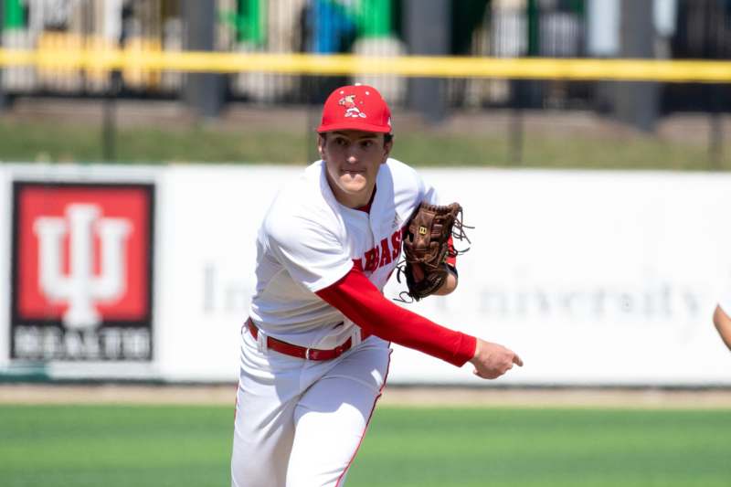 a baseball player throwing a ball