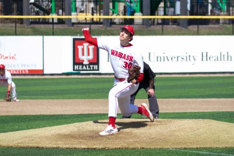 a baseball player throwing a ball