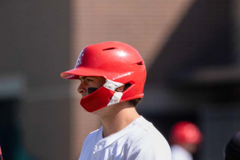 a man wearing a baseball helmet