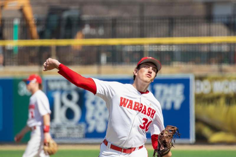 a baseball player throwing a ball