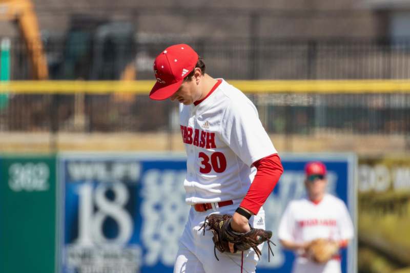 a baseball player in a red hat