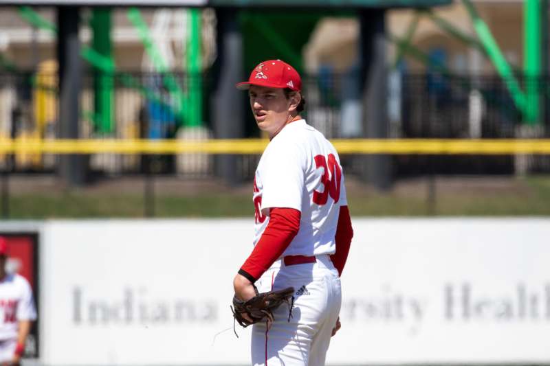a baseball player in a red hat