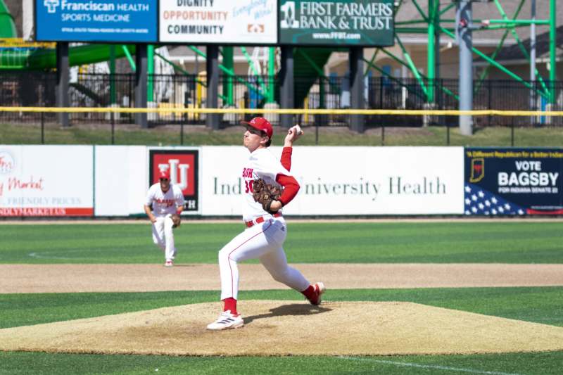 a baseball player throwing a ball