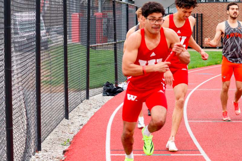 a group of men running on a track