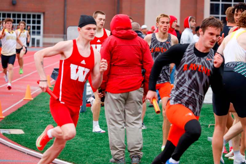 a group of people running on a track