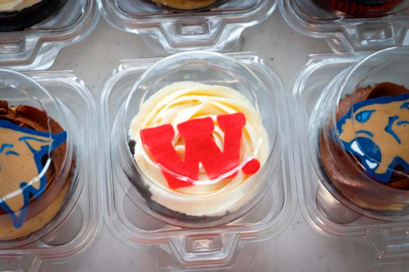 a group of plastic containers with cupcakes