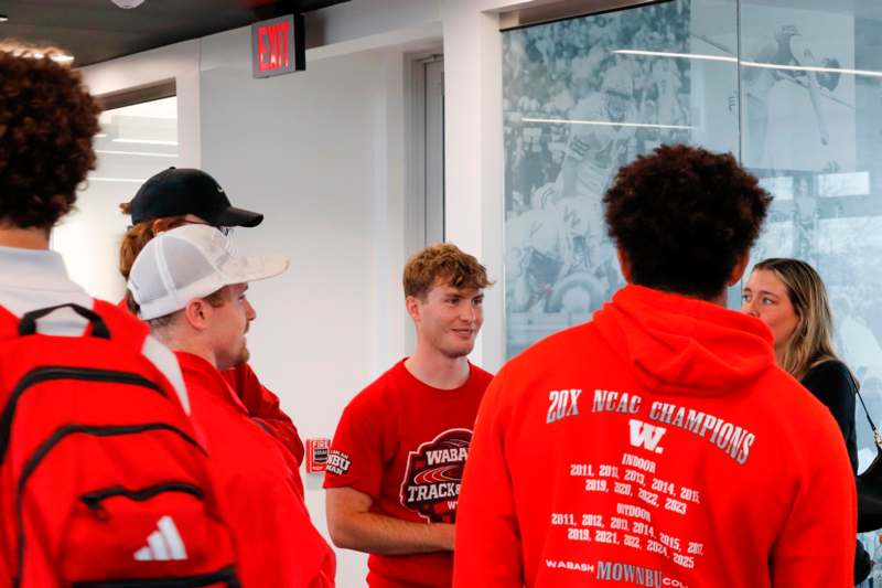 a group of people in red shirts