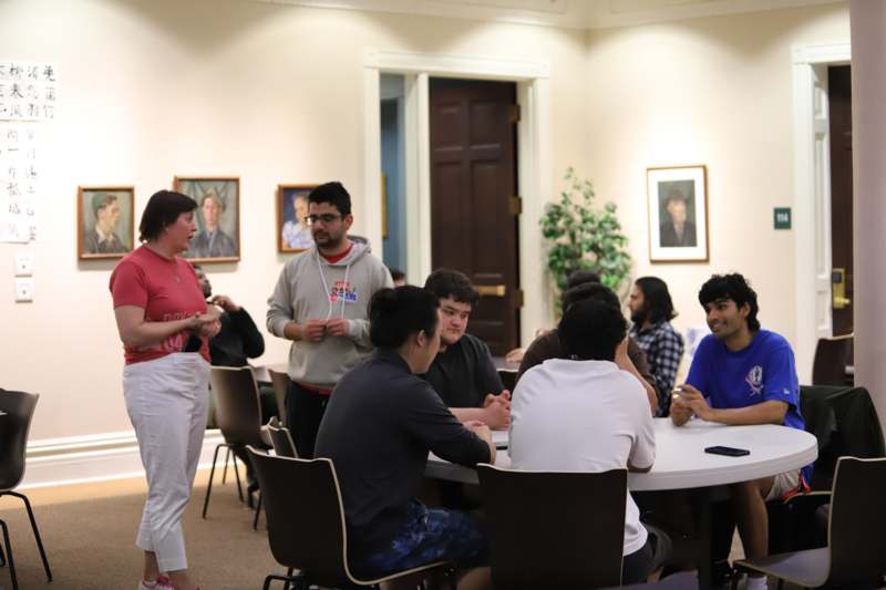 a group of people sitting around a table