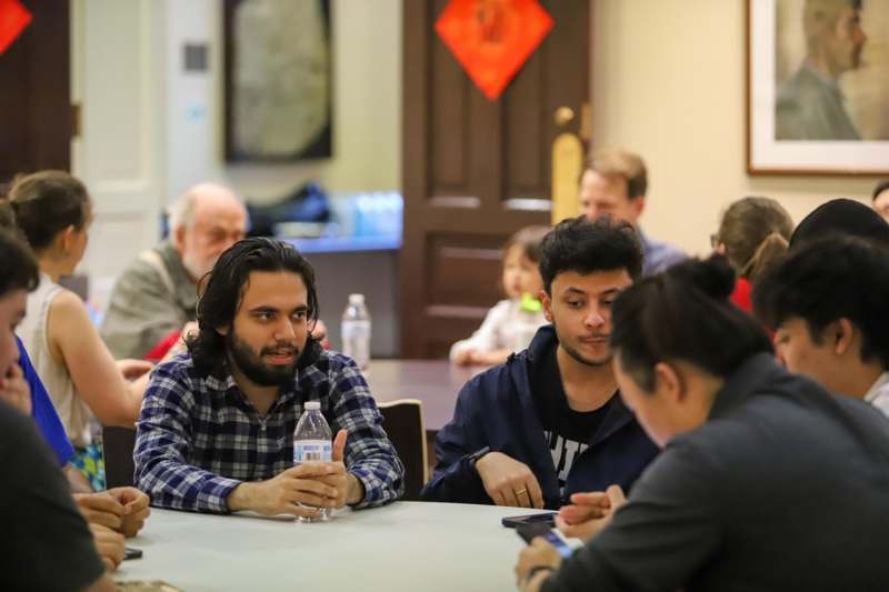 a group of people sitting around a table