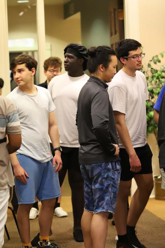 a group of people standing in a room