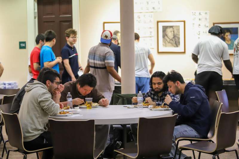a group of people eating at a table