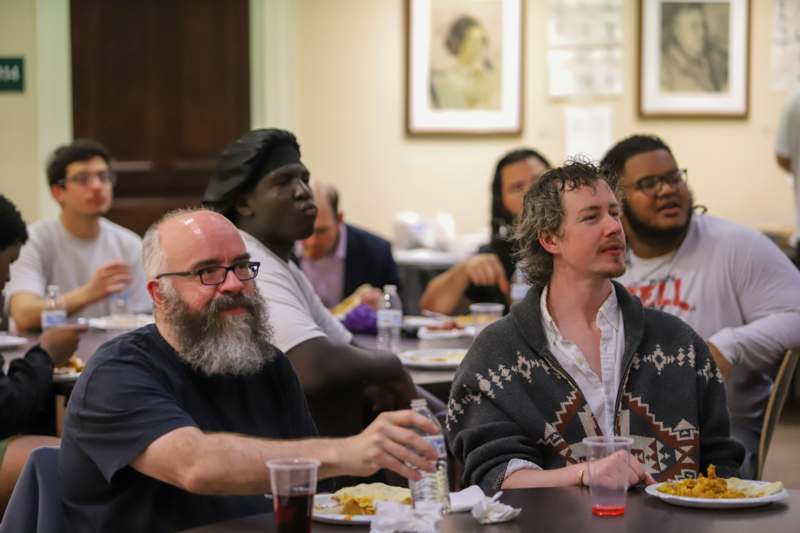 a group of people sitting at tables