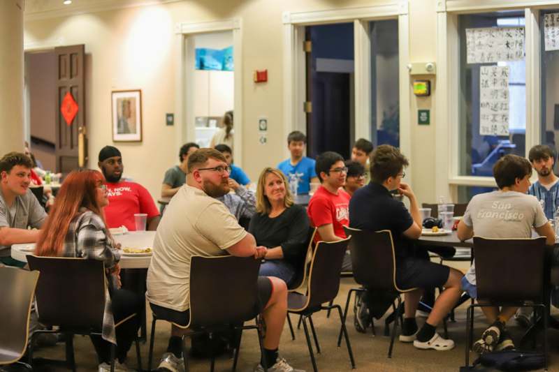 a group of people sitting at tables