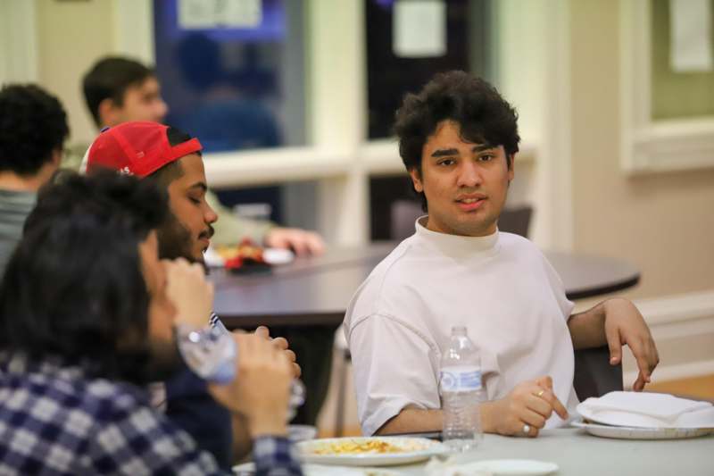 a group of people sitting at a table