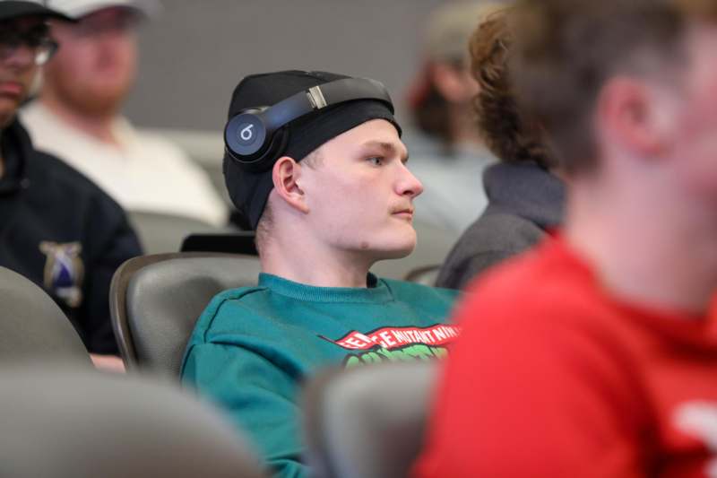 a man wearing headphones and a hat