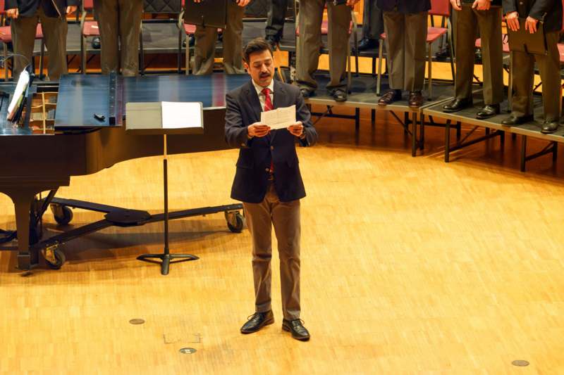 a man holding a piece of paper