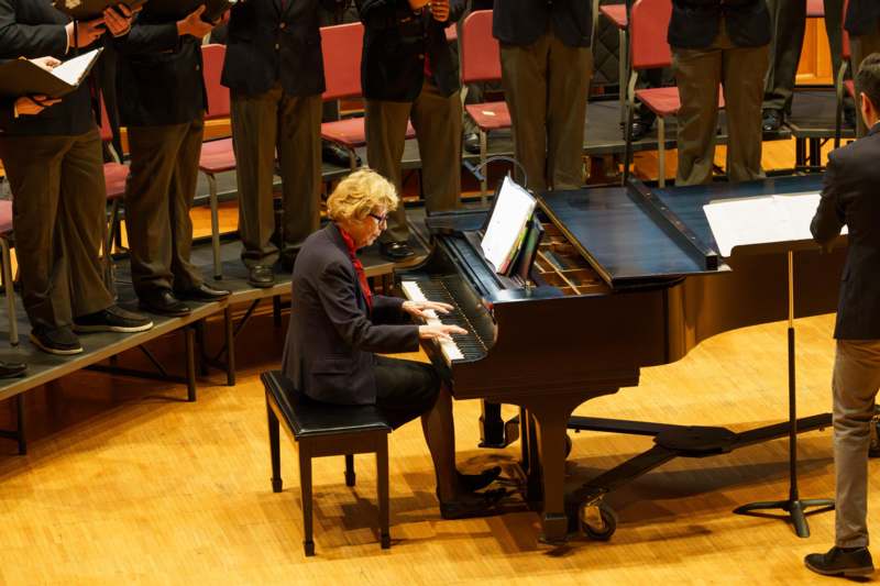 a woman playing a piano