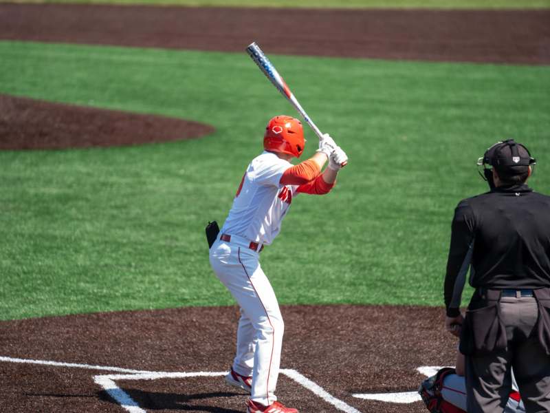 a baseball player holding a bat