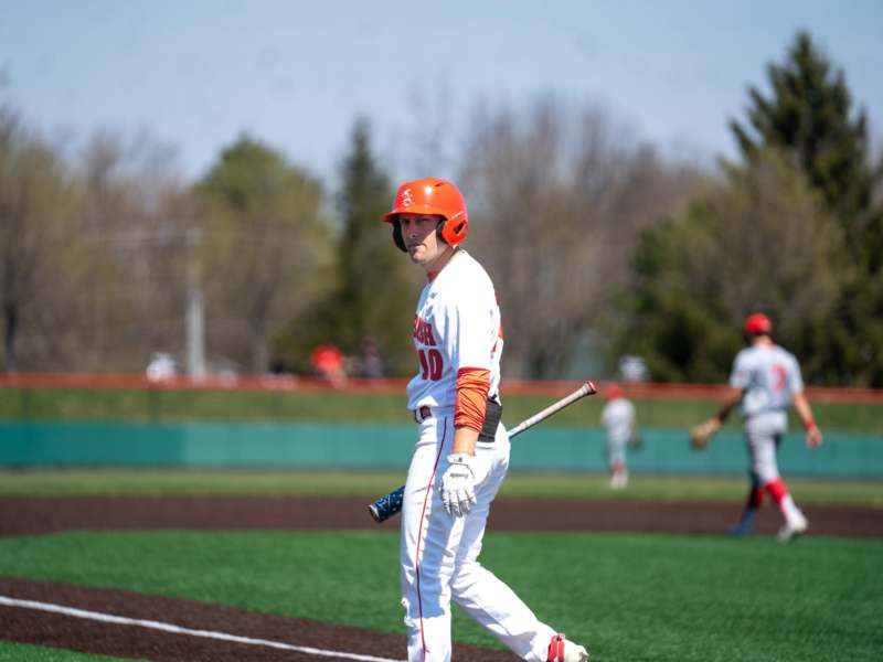 a baseball player holding a bat