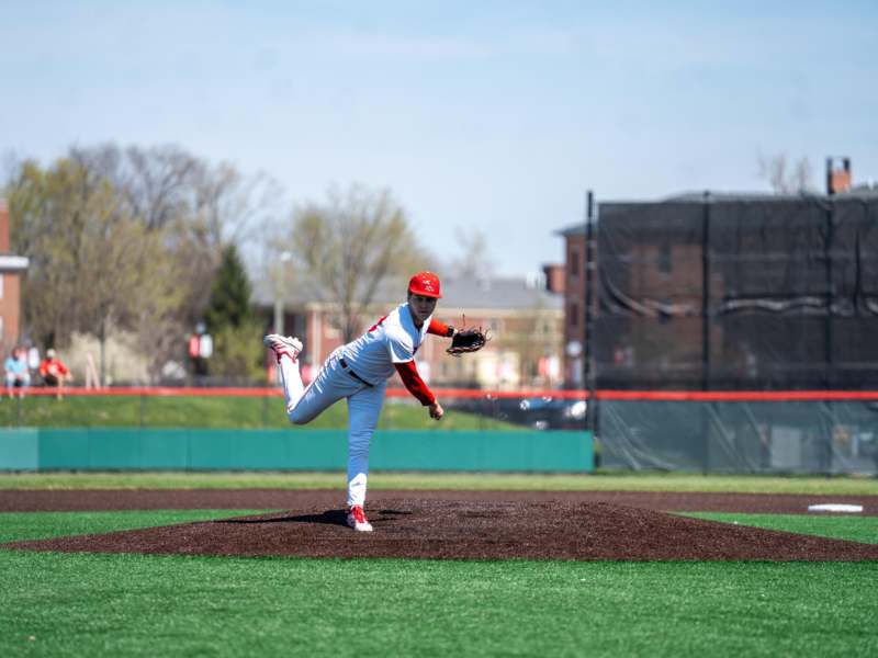 a baseball player throwing a ball