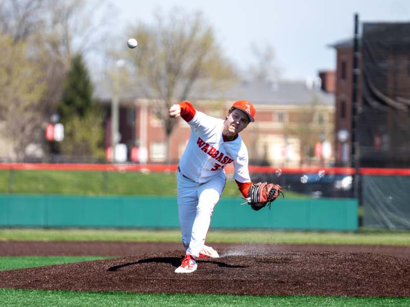 a baseball player throwing a ball