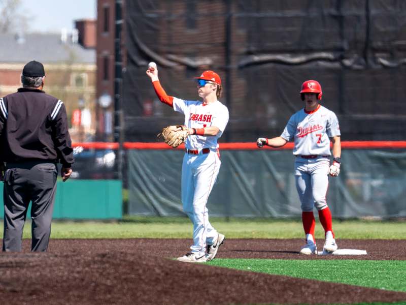 a baseball player throwing a baseball