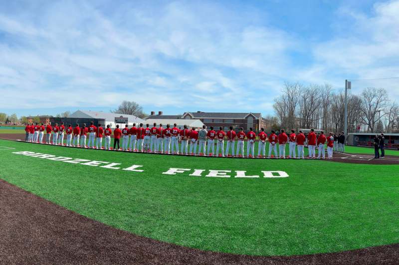 Birdzell Field Reception, Dedication, and Game Action (April 11, 2026) - a group of baseball players standing in a line on a field
