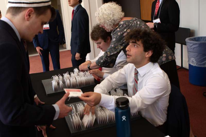 a group of people sitting at a table