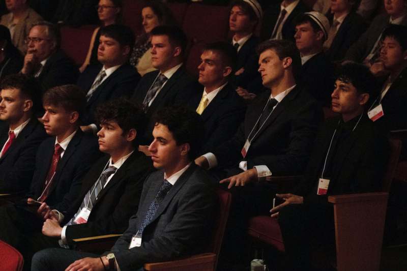 a group of people sitting in chairs